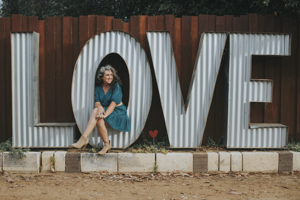 BIG LOVE sculpture at the Margaret River Marriage Office with Celebrant Anita Revel